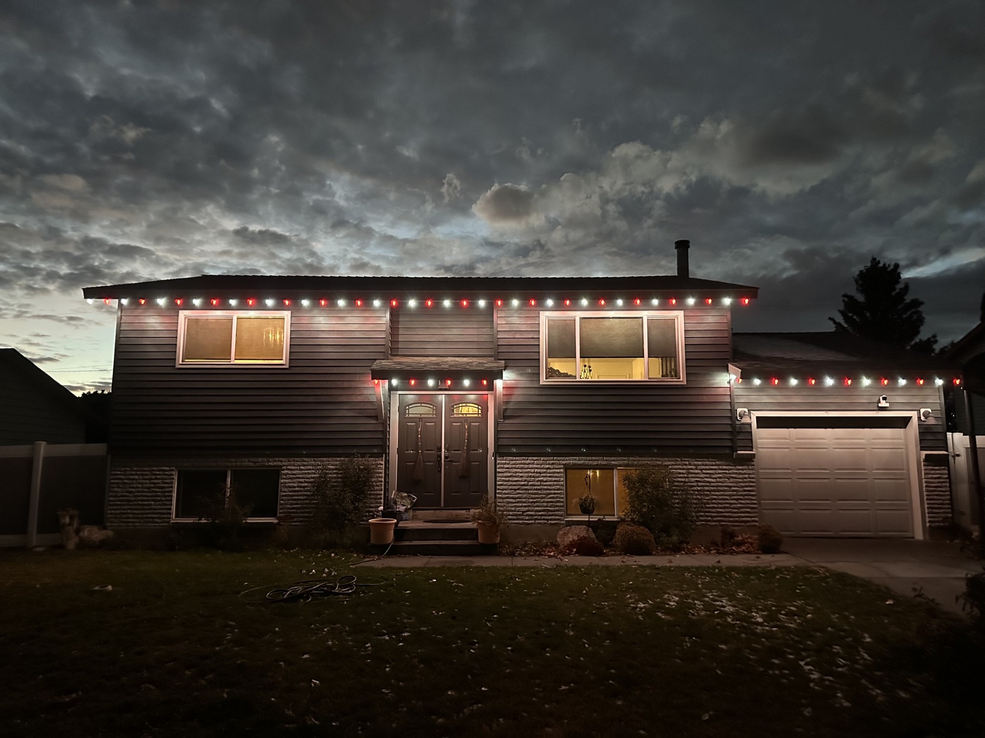 Pocatello home with red and cool white Christmas lights
